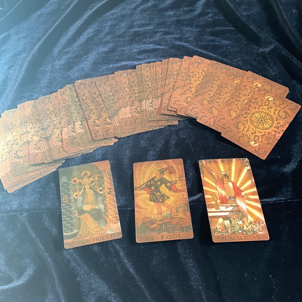 Beautiful golden iridescent tarot deck. Smudged,never used.
